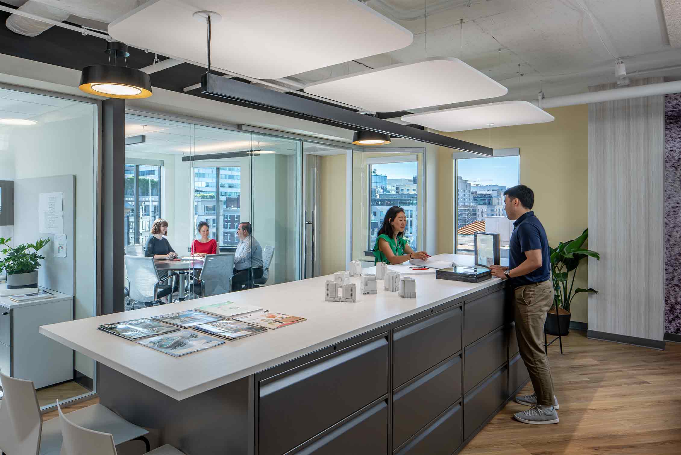 Coworkers collaborate under tunable white lighting at Page's D.C. Office