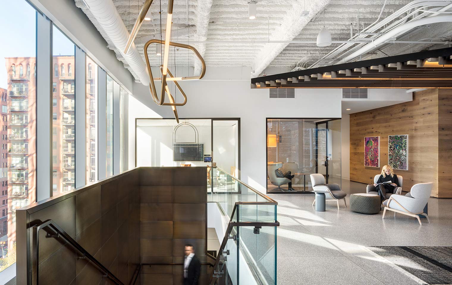 A sitting area at the top of stairs at Hyatt's HQ. Natural Light streams in the windows. Photo credit ©Rafael Gamo