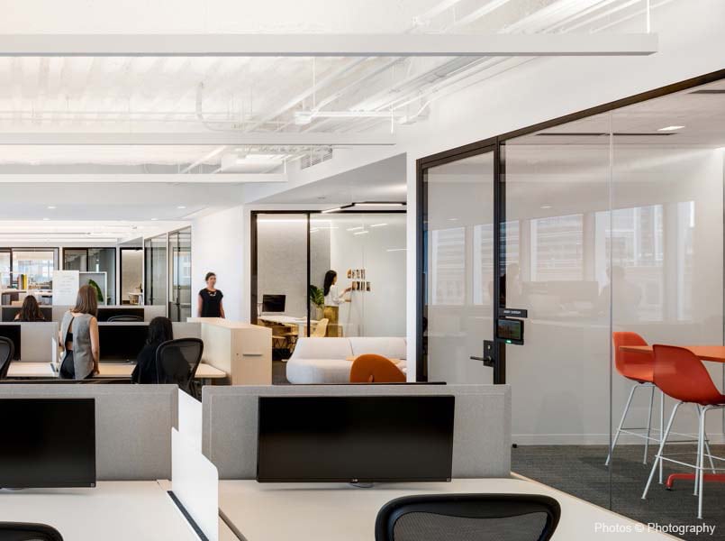 Office conference room and work stations lit with lutron commercial smart building technology